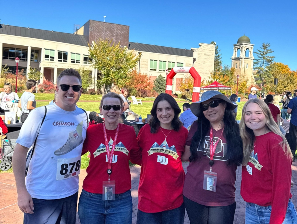 The Talent Acquisition and Development team at DU, at the CrimsonConnect event outside in the field.